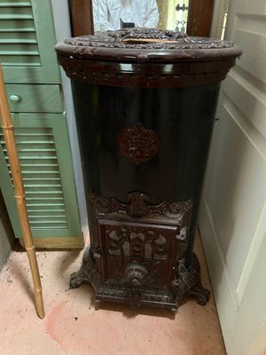 a black cabinet with a mirror on it in a room