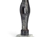 sculpture of a black and white abstract figure on a marble base