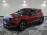 a red 2020 buick enclave suv parked in a showroom