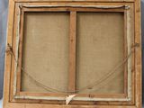 an old picture frame with a rope hanging from it ' s side