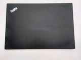 a black mouse pad with a red sticker on it