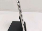 a cell phone that is sitting on top of a stand