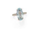 an oval aquamarinee ring with a diamond set in 18k gold