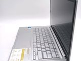a laptop computer sitting on top of a white table
