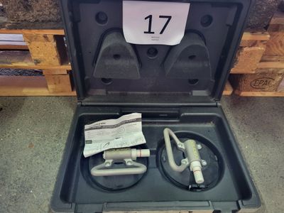 a black case with tools in it sitting on the floor