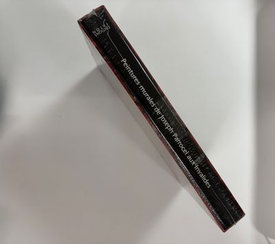 a close up of a tube of mascara on a white surface
