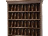 an old wooden bookcase with a lot of books on it