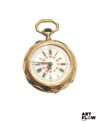 a gold pocket watch with roman numerals on it