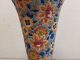 a vase that is sitting on a white table