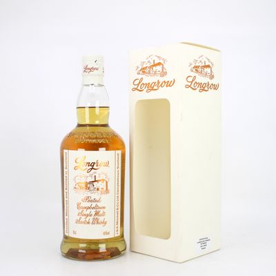 an image of a bottle of whisky next to a cardboard box