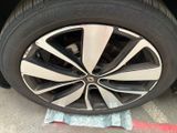 the tire of a car is shown with a cloth on the ground