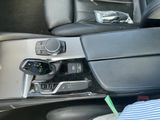 a close up of a car ' s dashboard with a remote control