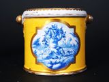 a yellow container with a blue and white design on it