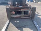 a picture of a forklift parked in a parking lot