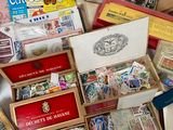many different types of stamps in a box on a table