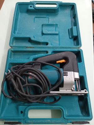 a blue box with a cord and a tool in it