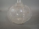 a clear glass bottle with a fish inside of it