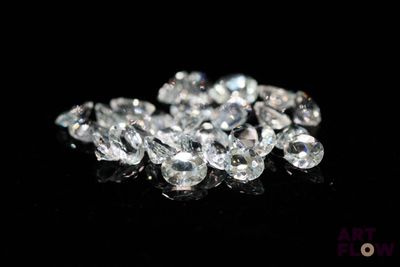 some very pretty white diamonds on a black surface