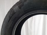 a close up of a tire on a white surface