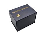 a close up of a black box with a gold logo on it