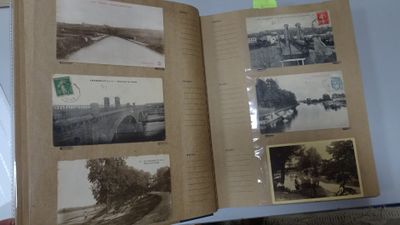 an open book with pictures on it on a table