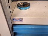a dog bowl sitting on top of a stack of drawers