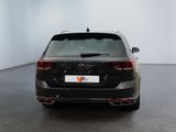 the back of a black volkswagen vw passat parked in a white room