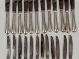 a lot of knives that are on a table