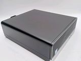 a close up of a black computer on a white surface