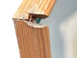 a close up of a wooden frame with a hole in it