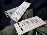 two tags attached to the back of a pair of pants