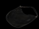 black leather handbag on a black background