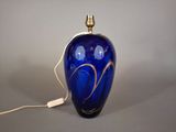 an image of a blue vase with a gold swirl on it