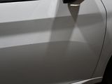 a close up of a car door handle with a sticker on it
