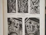 an open book with pictures of statues on it sitting on top of a table
