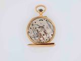 a gold pocket watch with a picture of a man riding a horse