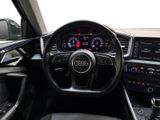 the interior of a car with a steering wheel and dashboard controls