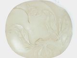 a picture of a white plate with a bird on it