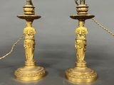 pair of antique brass candlesticks with figurines and chains