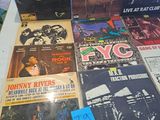 a lot of records on a table in a room