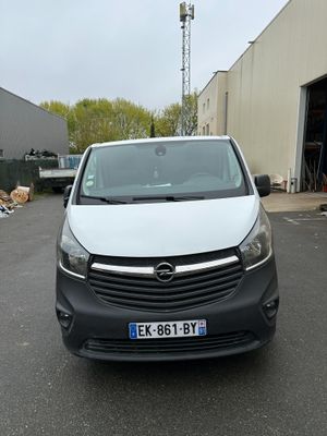 a picture of a white van parked in a parking lot