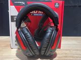 an image of a pair of headphones sitting on top of a wooden table
