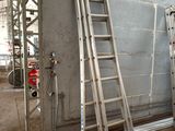 a ladder leaning against a wall in a building