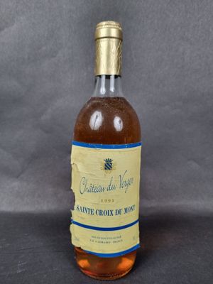 an image of a bottle of wine sitting on top of a table