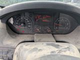 a dashboard of a truck with a speedometer and gauges
