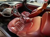 a picture of a car with red leather seats and a steering wheel