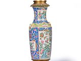a vase that is sitting on a stand on a white surface