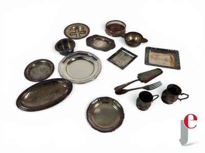 a lot of old silverware on a white surface