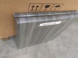 a box with a piece of metal on it next to a cardboard box