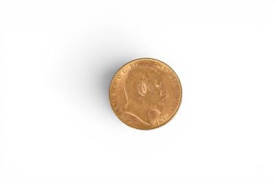 a close up of a coin on a white surface